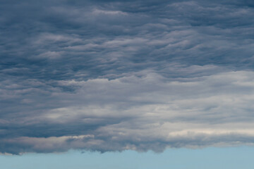 A bright hole in a swirl of dark clouds.