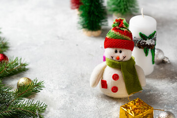 Christmas card concept with candle and snowman holiday background