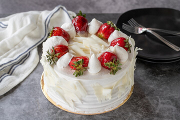 Strawberry cake. Strawberry birthday cake on dark background. Side view. close up