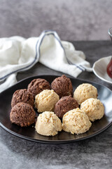 Sweet cookies. Delicious snack cookies on dark background. Bakery products. Vertical view. Close-up.