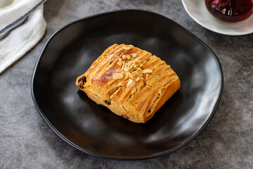 Sweet raisin cookies. Cookies with hazelnuts and raisins on a dark background. Bakery products. side view. Local name kavala cookies. Close-up.