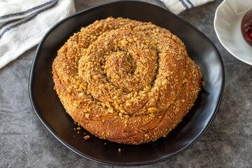 Poppy donut. Poppy bun on dark background. Bakery products. side view. Turkish cuisine. Local name hashasli corek. Close-up.