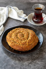 Poppy donut. Poppy bun on dark background. Bakery products. Vertical view. Turkish cuisine. Local name hashasli corek. Close-up.