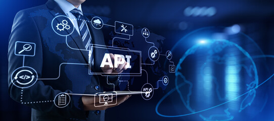 Fototapeta na wymiar API Application programming interface. Businessman pressing virtual button.