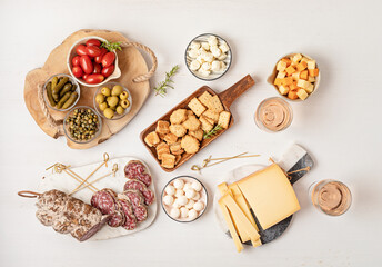 Appetizers table with different antipasti, charcuterie, snacks, cheese. Finger food for buffet party. Traditional french or italian entires. Top view - obrazy, fototapety, plakaty