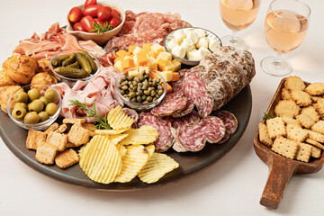 Appetizers table with different antipasti, charcuterie, snacks, cheese. Finger food for buffet party. Traditional french or italian entires. Top view