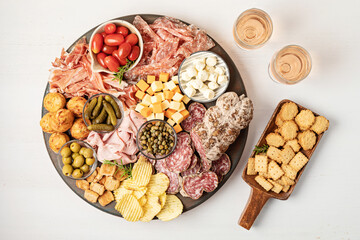 Appetizers table with different antipasti, charcuterie, snacks, cheese. Finger food for buffet...