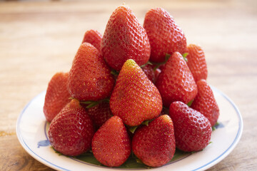 fresh strawberries in a pyramid pile