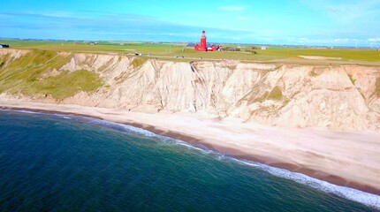 view from the sea to the famous Bovbjerg Fyr lighthouse in Jutland, Denmark, high quality image, aerial view - obrazy, fototapety, plakaty