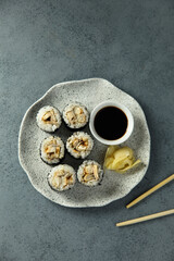 Eel sushi with soy sauce and ginger