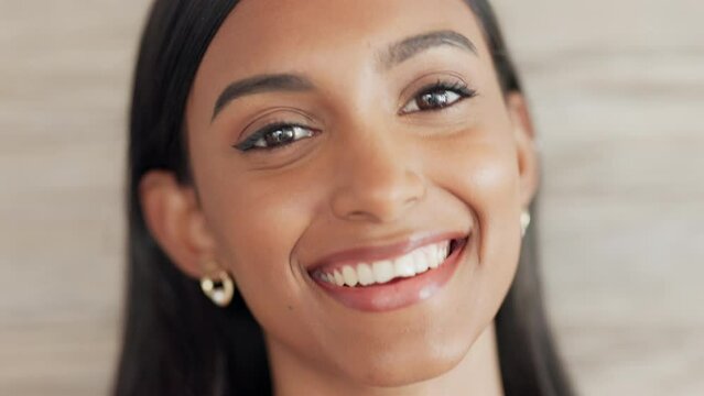 Closeup portrait of a happy and confident female smiling with perfect teeth due to oral and dental hygiene. Face of a beautiful student or intern feeling excited, in a good mood and ready for success