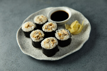Eel sushi with soy sauce and ginger
