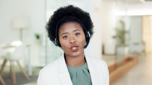 Portrait of interpreter talking, wearing headset and translating foreign language to local speakers in office. Confident and friendly translator with afro hosting online conference call for diplomats