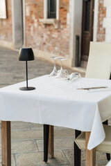 outdoor table and chairs in a restaurant in Venice, Italy 