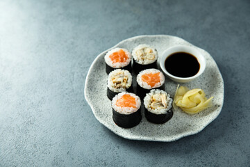 Healthy sushi rolls with salmon and eel