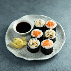 Healthy sushi rolls with salmon and eel