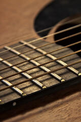 Detail of an acoustic guitar. Close up. Vertical.