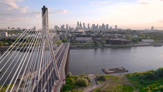 Aerial view of the Warsaw cable bridge in the sunset with city on the background, 4k