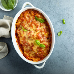 Traditional homemade lasagna with fresh basil	