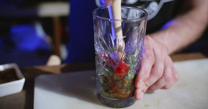 The Bartender Making a Mojito Cocktail