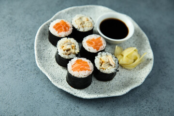 Healthy sushi rolls with salmon and eel