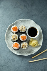 Healthy sushi rolls with salmon and eel