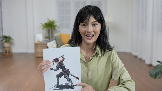 Business concept of 4k Resolution. Young Asian designer presenting her work in the office. video call interview.