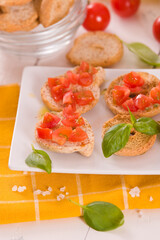 Friselle with cherry tomatoes and basil.