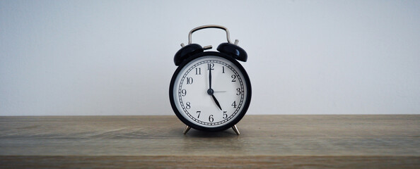 Analog alarm clock pointing at hours, minutes, seconds to display time - Photo of digital timer for...