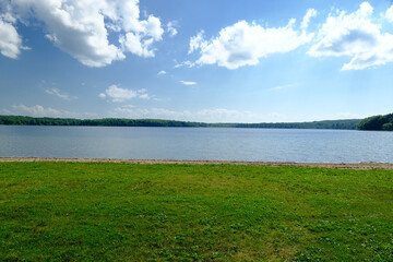 Blue sky, beautiful lake, and fresh green grass