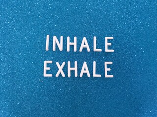  inhale exhale word on blue background
