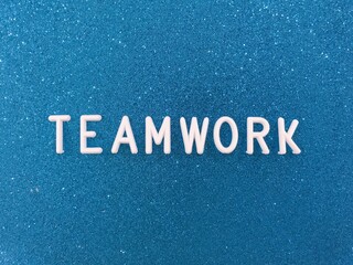teamwork word on blue background
