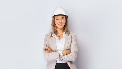 Young european female architect wearing safety helmet over isolated white background with big smile...