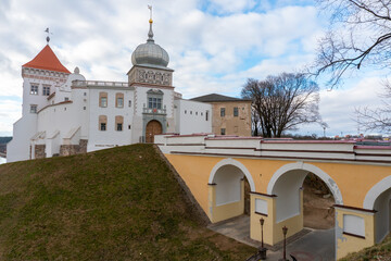 Fototapeta na wymiar GRODNO, BELARUS JULY 1, 2022: The old castle after repair and restoration in Grodno. A beautiful historical building in a European city.