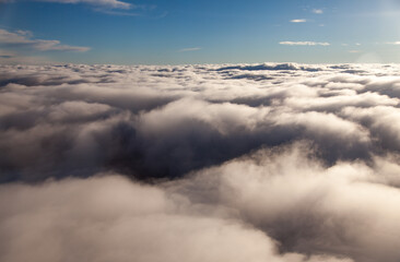 Naklejka premium View from above from the clouds during the day.