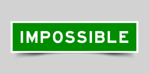 Sticker label with word impossible in green color on gray background