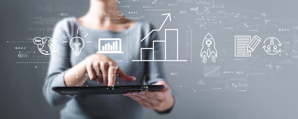 Business growth analysis with business woman using a tablet computer