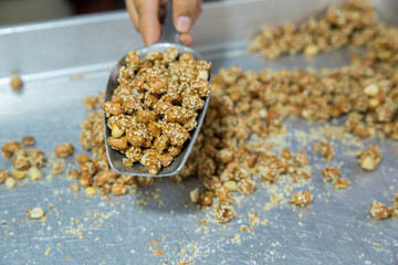 Candied peanuts background, focus selective.