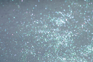 Background with defocused shiny lights in blue color