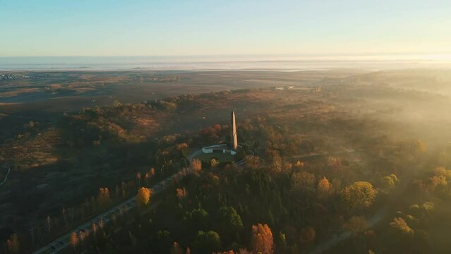 Dawn with fog at the Glory Memorial. Autumn city of Rivne Ukraine. Aerial shot