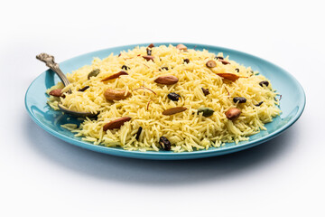Kashmiri sweet modur pulao made of rice cooked with sugar, water flavored with Saffron and dry...