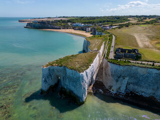 kingsgate bay chalk ckiffs with arch way seaside town kent golden beach in the background