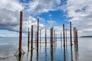 Metal pipes sticking out of ocean in Fredericia