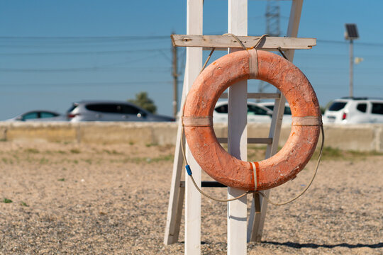 Old Crimea beach saver life preserver protection equipment red sea, for rescue save from belt from sky summer, object background. Travel sunrise round,