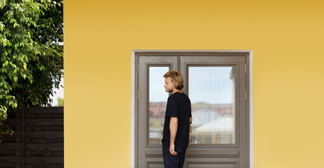 Fototapeta premium Man opening the door of her home.Inviting the guests