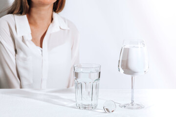 Casual style young woman with water glasses. Female model