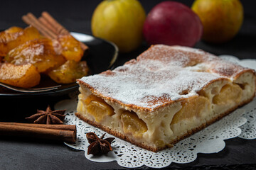 Plum dessert on a black background. Fruit home cooking. fruit dessert
