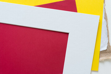 white paper frame with yellow and red paper