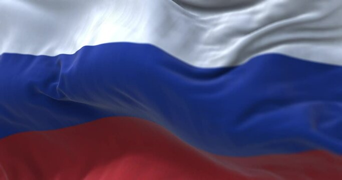 Close-up view of the Russian national flag waving in the wind