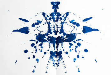Rorschach test used in Psychoanalysis. Blue, symmetric, mirror images made of granulated ink on...